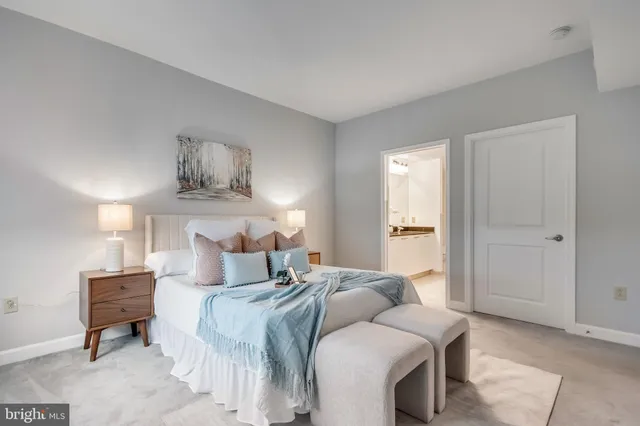 a bedroom with bed and window