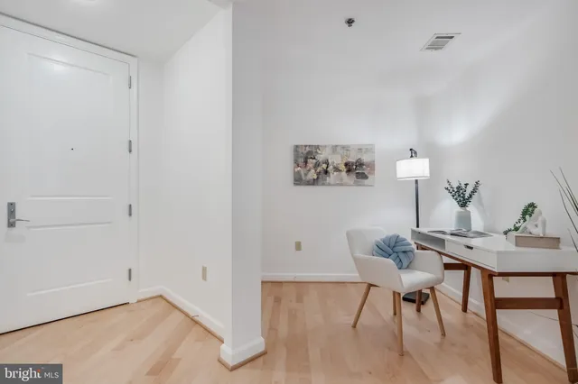 a workspace with furniture and wooden floor