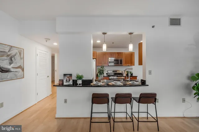 a kitchen with a table and chairs in it