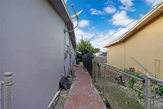 a view of a pathway of a house with wooden floor