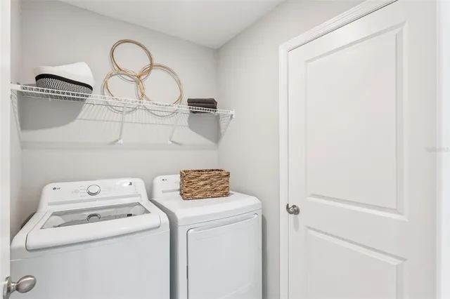 a utility room with dryer and washer