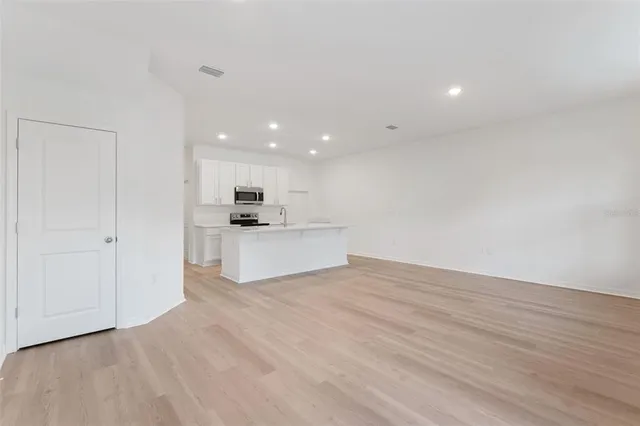 a view of kitchen with wooden floor and window