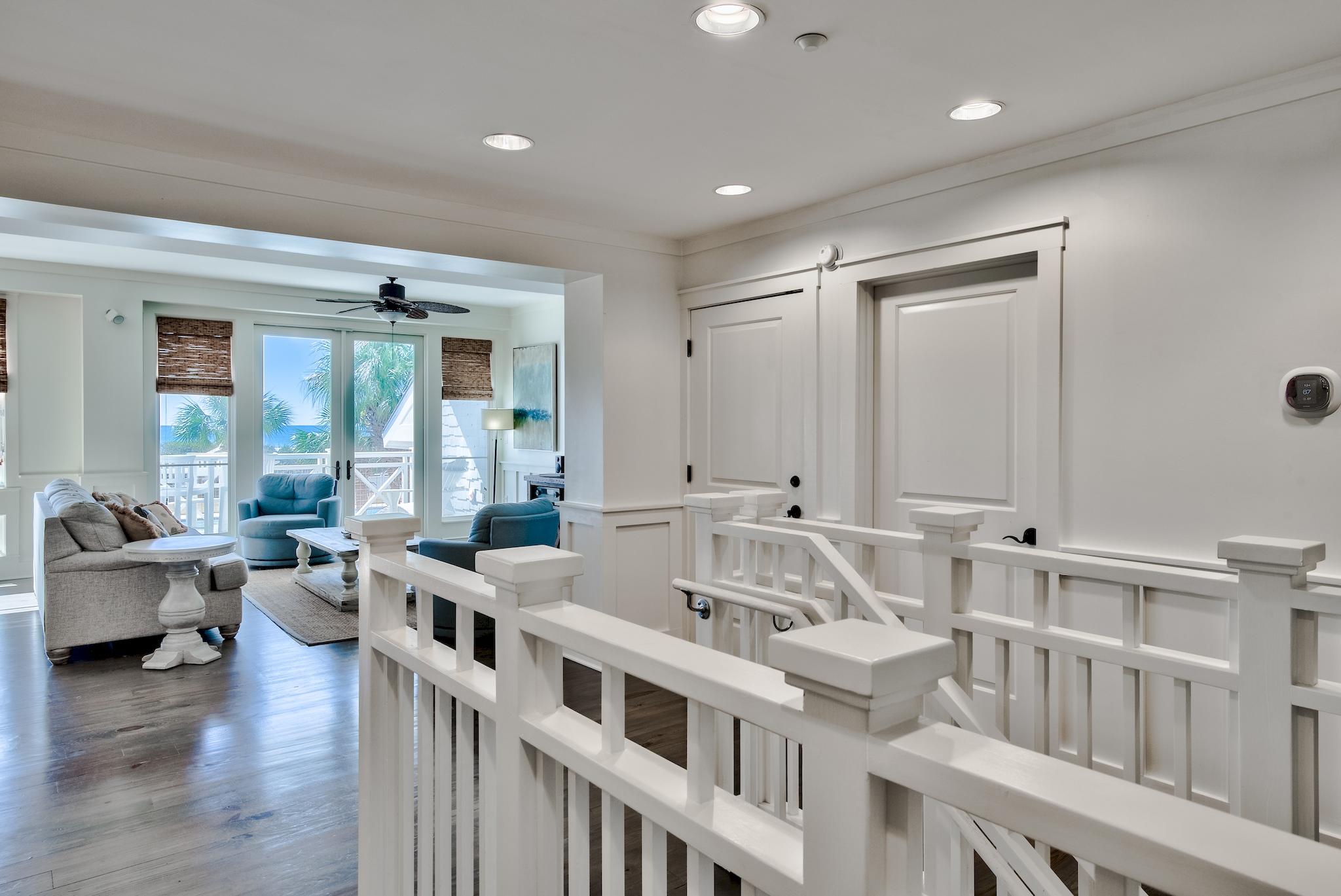 337 Bridge Lane, Unit B102 Watersound, FL 32461 - Photo 15 of 41 a very nice looking living room with a large window and wooden floor