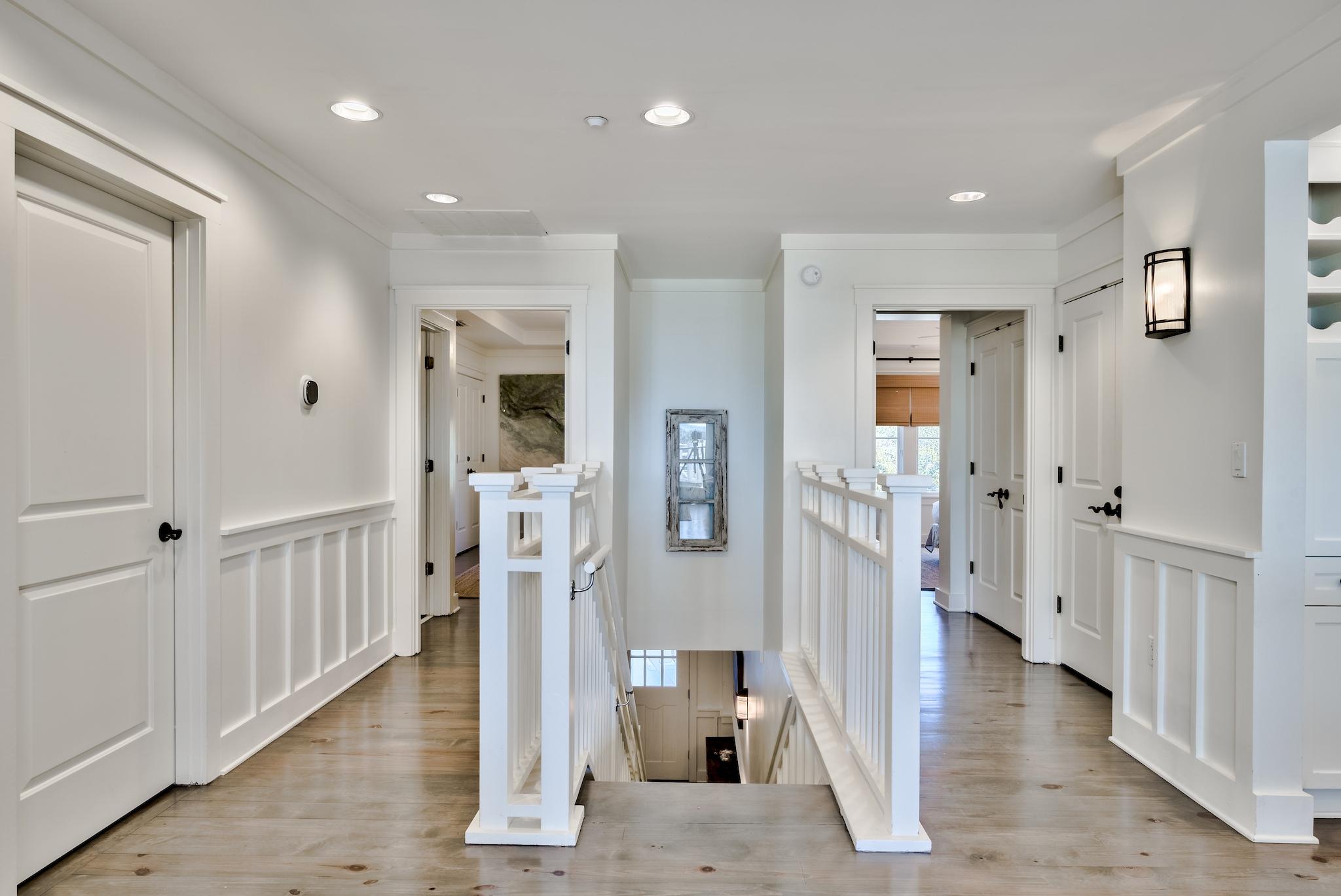 337 Bridge Lane, Unit B102 Watersound, FL 32461 - Photo 16 of 41 a view of a hallway with wooden floor and entryway
