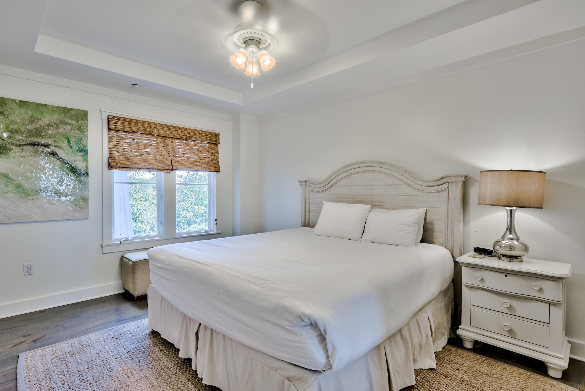 337 Bridge Lane, Unit B102 Watersound, FL 32461 - Photo 20 of 41 a bedroom with a bed and a window