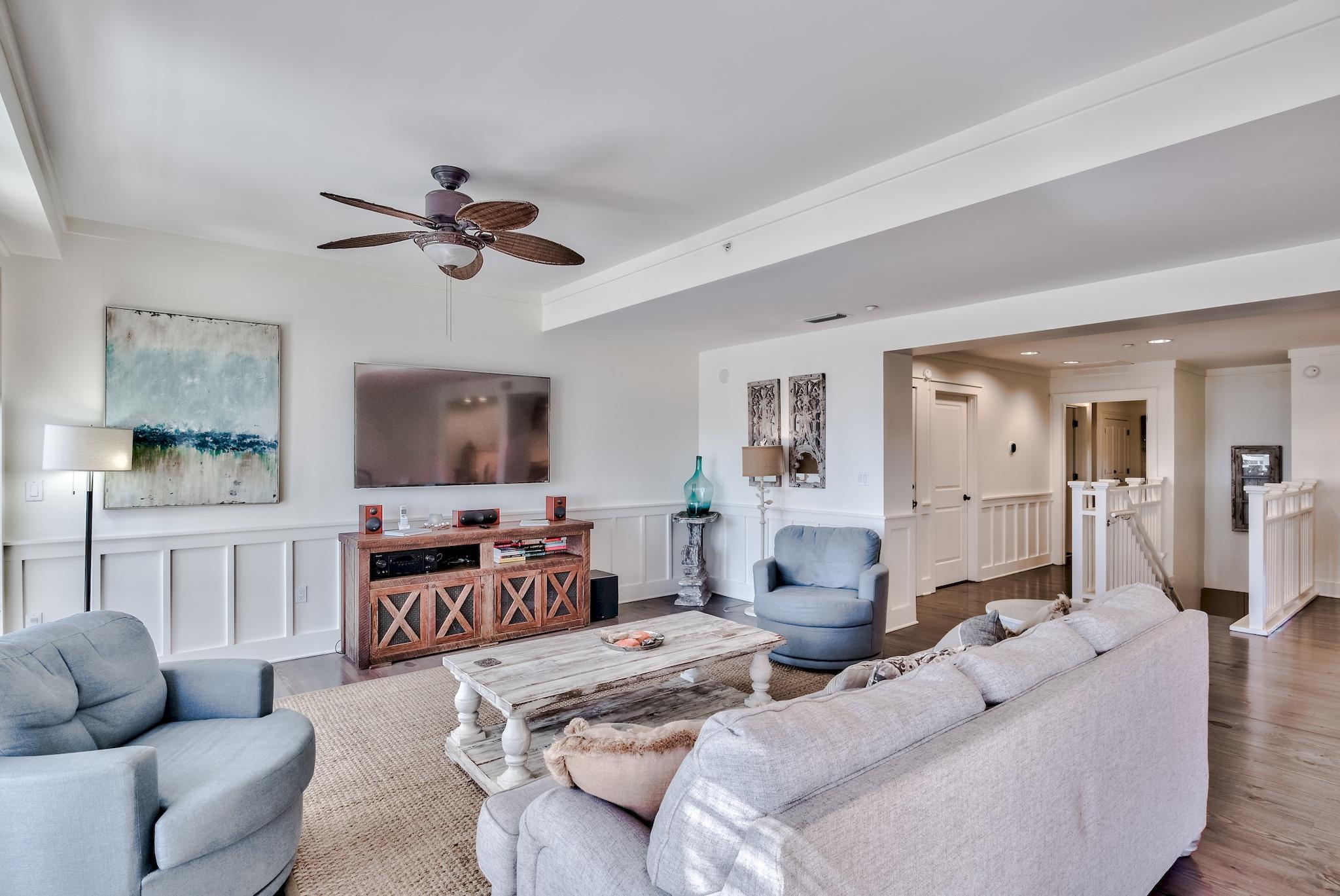 337 Bridge Lane, Unit B102 Watersound, FL 32461 - Photo 7 of 41 a living room with furniture kitchen view and a flat screen tv