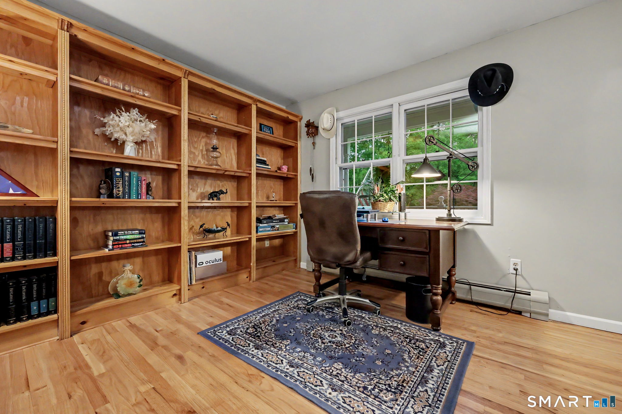 571 Wheeler Road Monroe, CT 06468 - Photo 12 of 40 a view of a workspace with furniture and a window