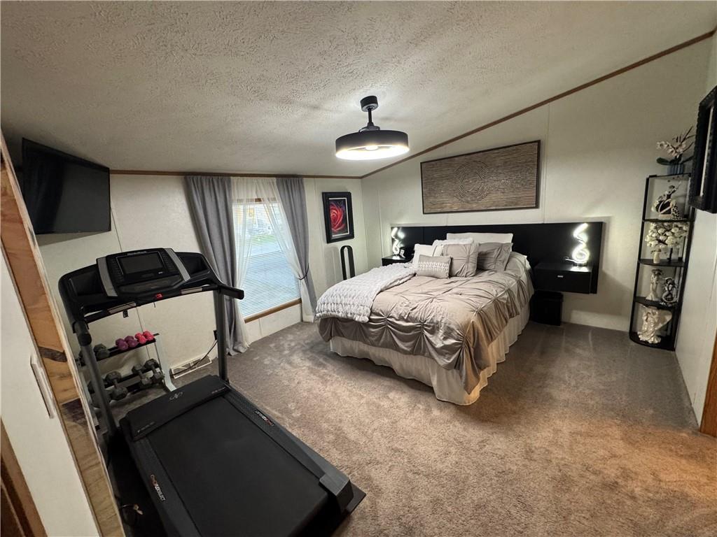 505 Amy Lane Rochester, PA 15074 - Photo 15 of 22 a bedroom with a bed and a chandelier