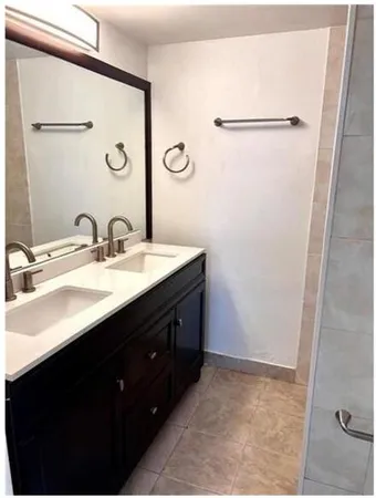 an empty room with wooden floor and closet
