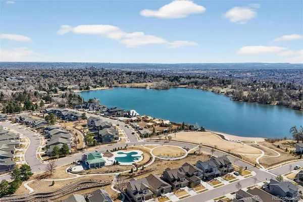 an aerial view of a house with a table and chairs