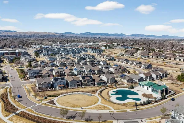 a view of a swimming pool with a table and chairs