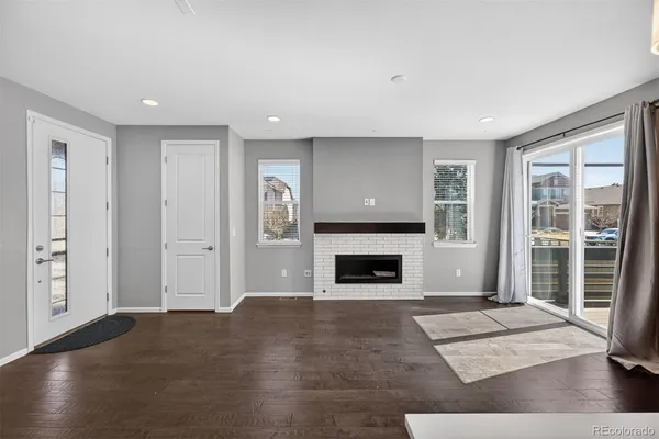 a view of livingroom with furniture and a fireplace