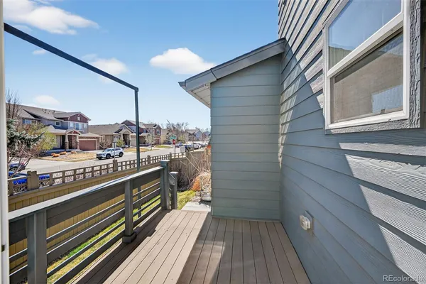a view of a balcony with wooden floor