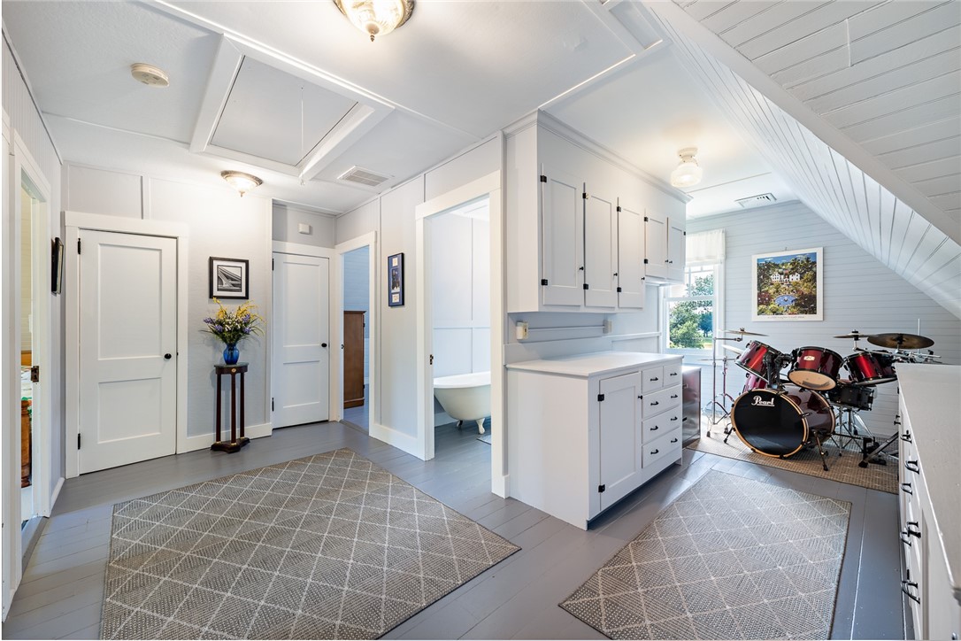 65 Rhode Island Avenue Warwick, RI 02889 - Photo 44 of 50 Third floor - Three versatile rooms (not all room photos are shown in MLS listing - see 3D Matterport tour), a full bath, in addition to a bonus, family room. There are drop down stairs to an attic with generous ceiling height - great for storage.
