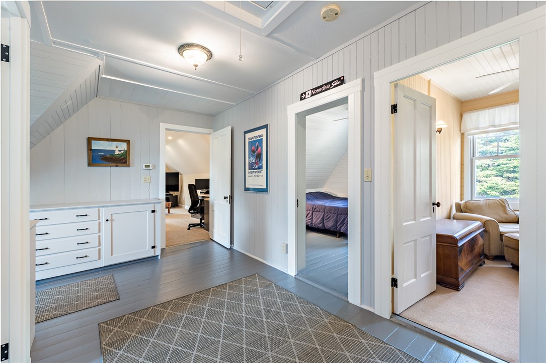 65 Rhode Island Avenue Warwick, RI 02889 - Photo 45 of 50 Third floor - three versatile rooms (not all rooms photos are in the MLS listing - see 3D Matterport Tour), a full bath, in addition to a bonus, family room. There are drop down stairs to an attic with generous ceiling height - great for storage.