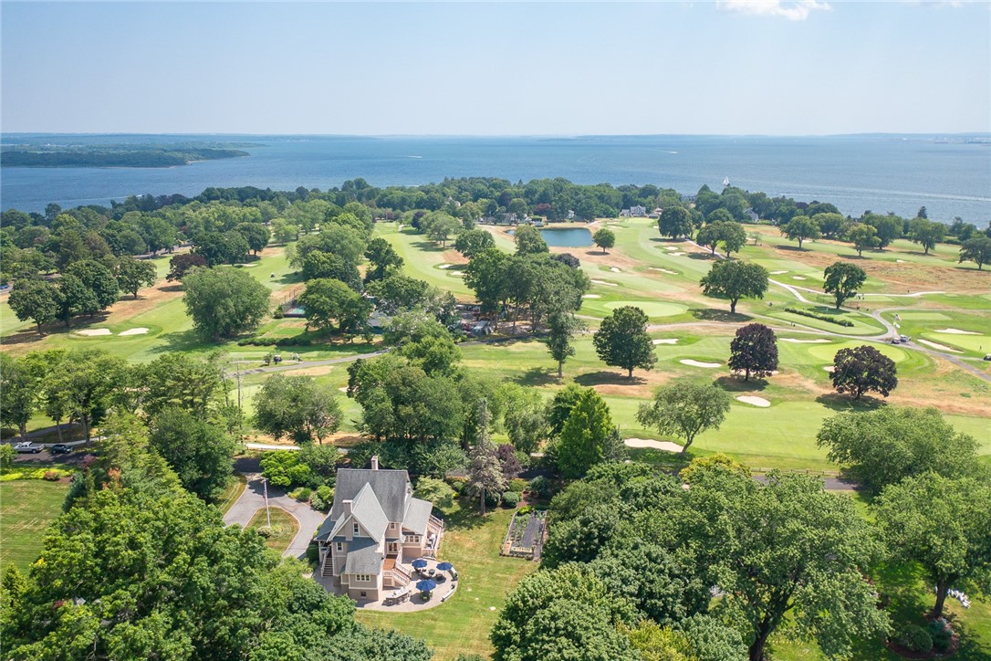 65 Rhode Island Avenue Warwick, RI 02889 - Photo 50 of 50 Front porch overlooks the 14th hole at Warwick Country Club with views of Greenwich/Narragansett Bay beyond.