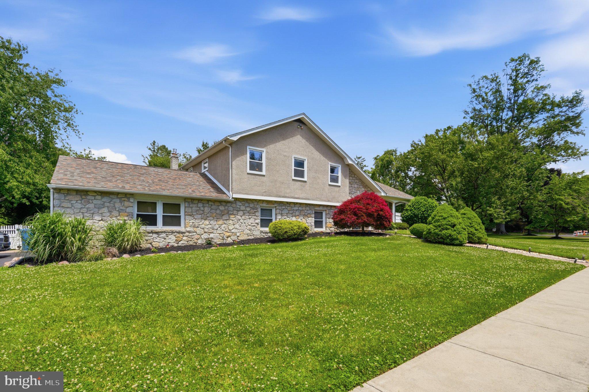 1002 Tannerie Run Road Ambler, PA 19002 - Photo 5 of 67 Charming home with lush greenery.