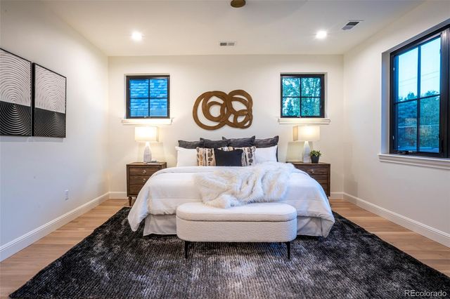 a bed room with a bed and a window