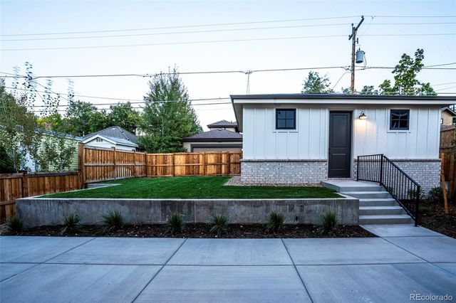 a view of backyard and entertaining space