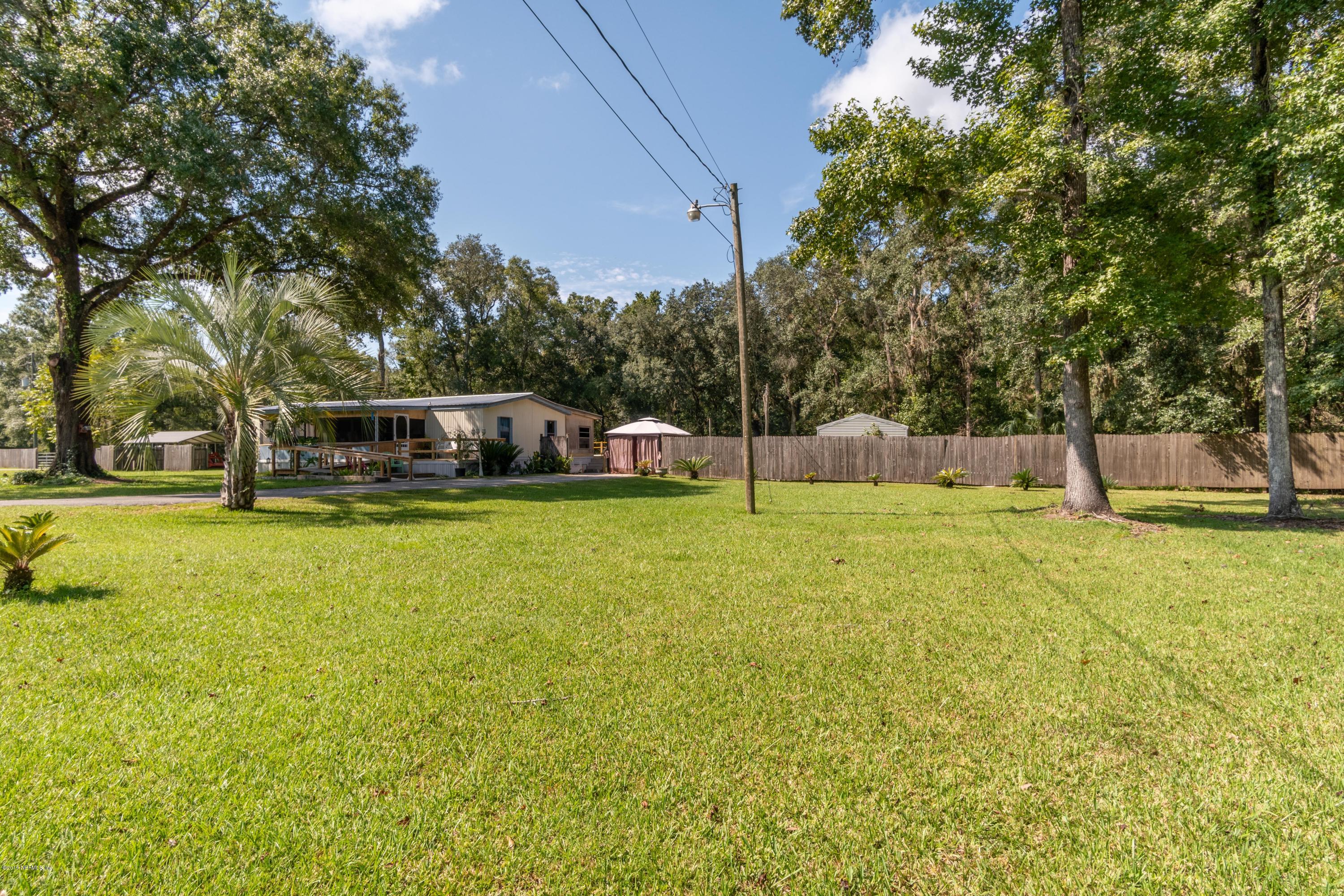44575 Keme Road Callahan, FL 32011 - Photo 8 of 25 Front of Home from side