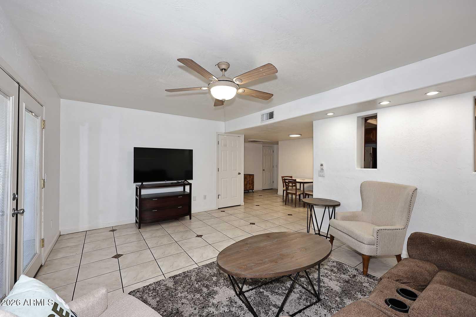 151 East Broadway Road, Unit 103 Tempe, AZ 85282 - Photo 2 of 37 Great Room to Dining Area & Front Entry