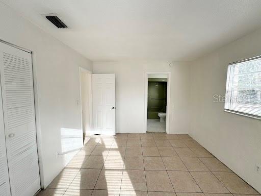 1221 Kennedy Road, Unit 48 Daytona Beach, FL 32117 - Photo 11 of 12 a view of an empty room and window