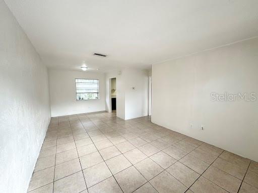 1221 Kennedy Road, Unit 48 Daytona Beach, FL 32117 - Photo 2 of 12 a view of an empty room and window