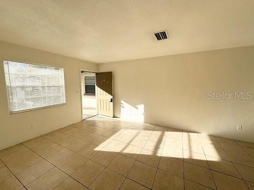 1221 Kennedy Road, Unit 48 Daytona Beach, FL 32117 - Photo 4 of 12 a view of an empty room and window