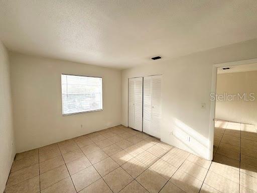 1221 Kennedy Road, Unit 48 Daytona Beach, FL 32117 - Photo 9 of 12 a view of an empty room and window