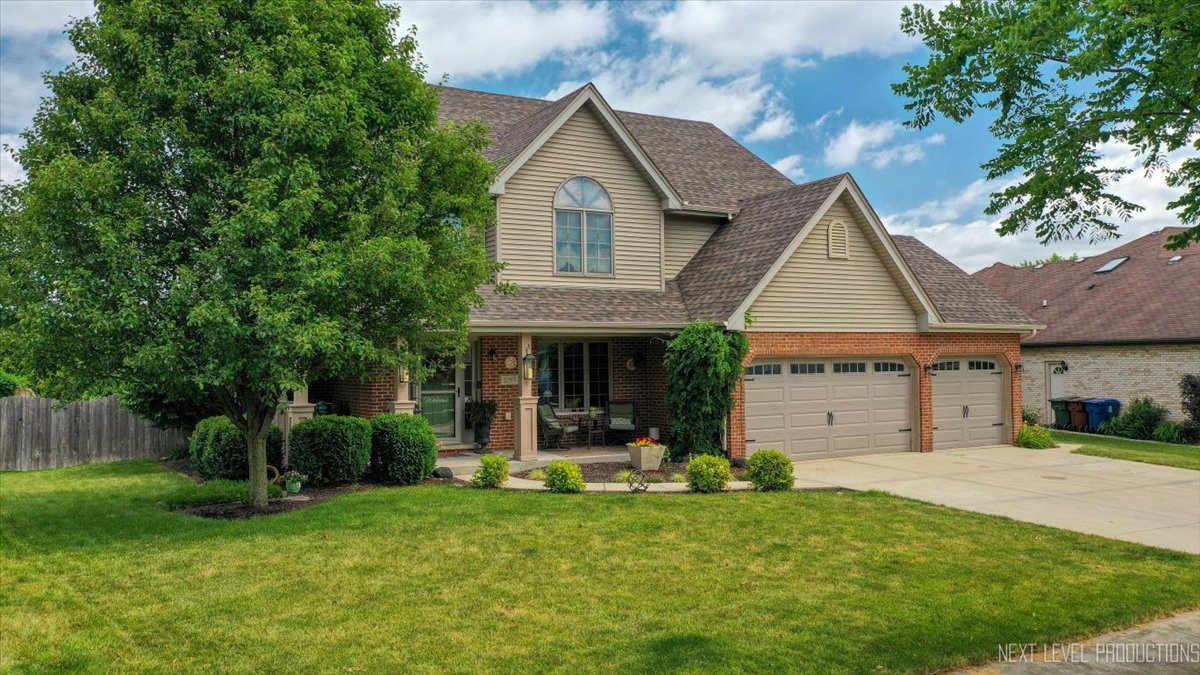 1285 O'Connell Circle New Lenox, IL 60451 - Photo 3 of 42 a front view of a house with a yard and porch
