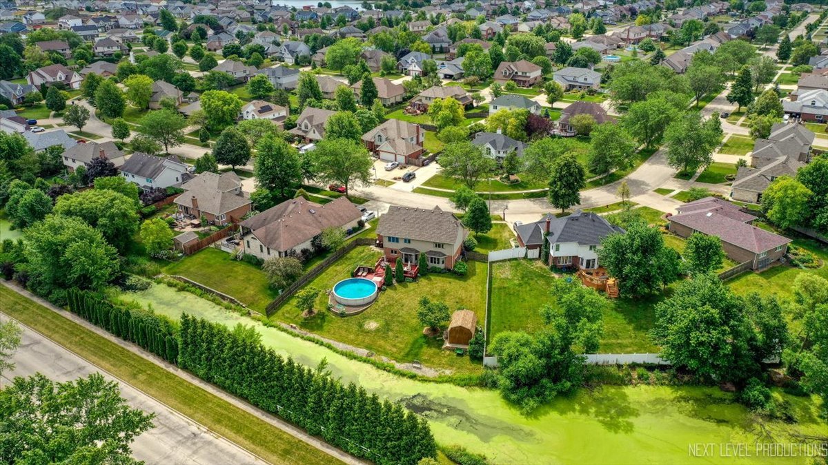 1285 O'Connell Circle New Lenox, IL 60451 - Photo 37 of 42 an aerial view of a residential houses with city street and trees