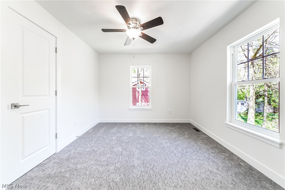 3959 Ardmore Road Cleveland Heights, OH 44121 - Photo 24 of 38 Carpeted empty room with ceiling fan