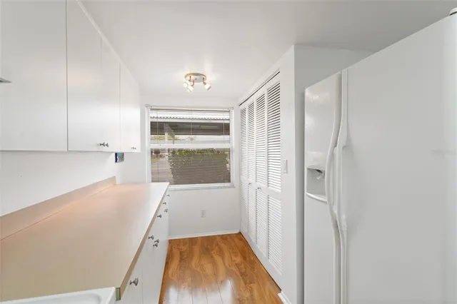 a view of a kitchen with a sink and dishwasher