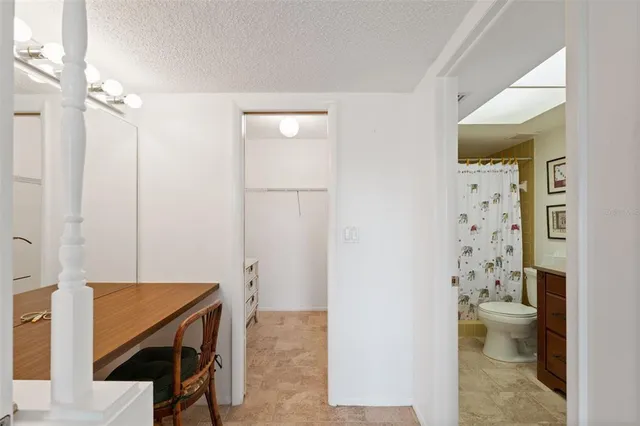 a bathroom with a shower toilet and sink