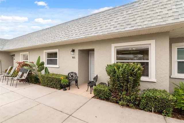 a front view of house with yard outdoor seating and barbeque oven