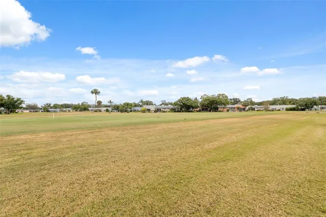a terrace with outdoor seating and city view
