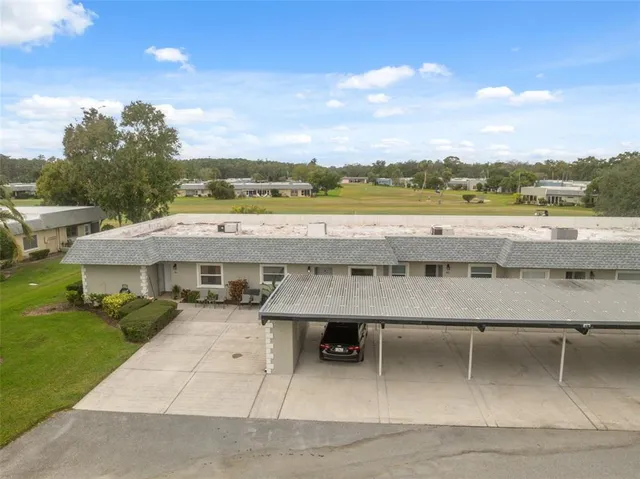a terrace with outdoor seating and city view