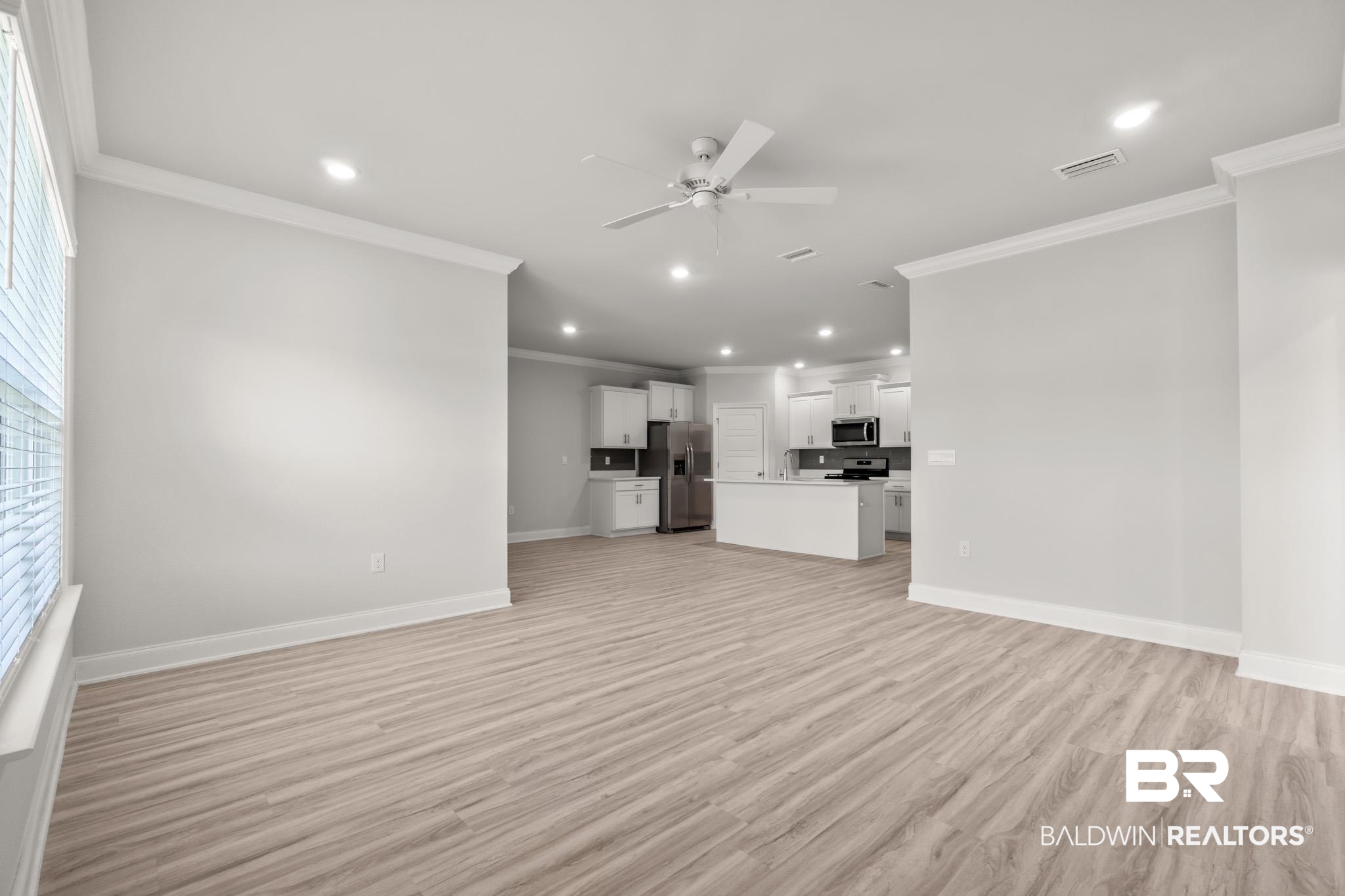 32125 Lyon Road Daphne, AL 36527 - Photo 4 of 70 Open-concept living area featuring wood-finish flooring, recessed lighting, and a ceiling fan