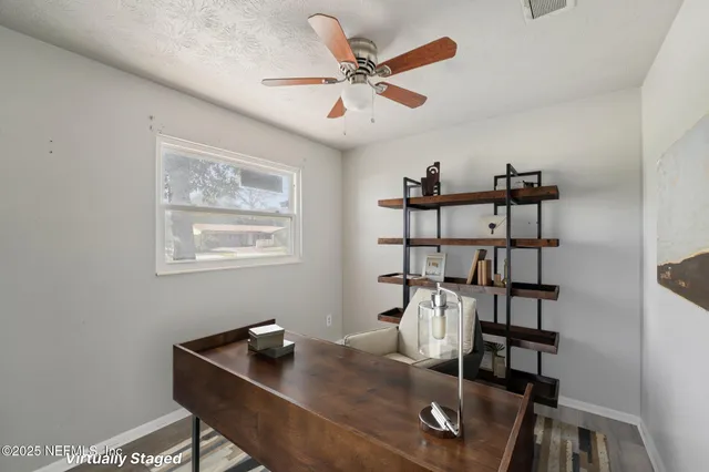 a work room with table and chairs