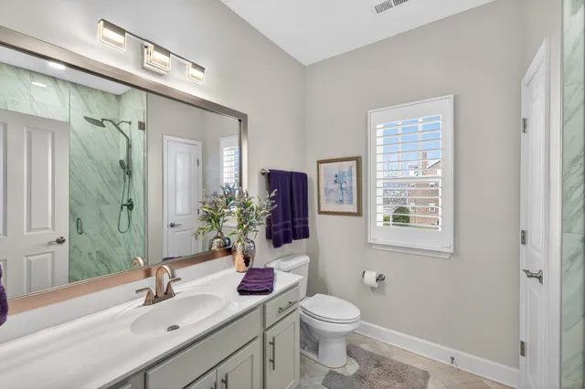 a bedroom with bed and a couch