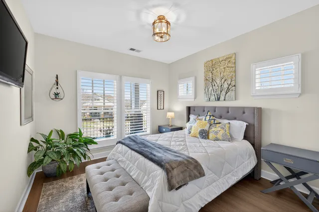 a bedroom with furniture and a window