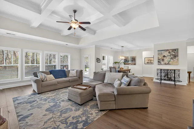 a view of a dining room with furniture window and wooden floor