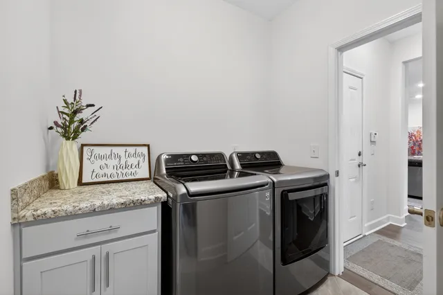 a view of a hallway with couch and wooden floor
