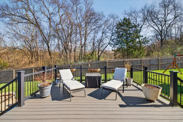 a view of a house with backyard porch and sitting area