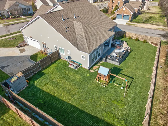 an aerial view of a house with outdoor space
