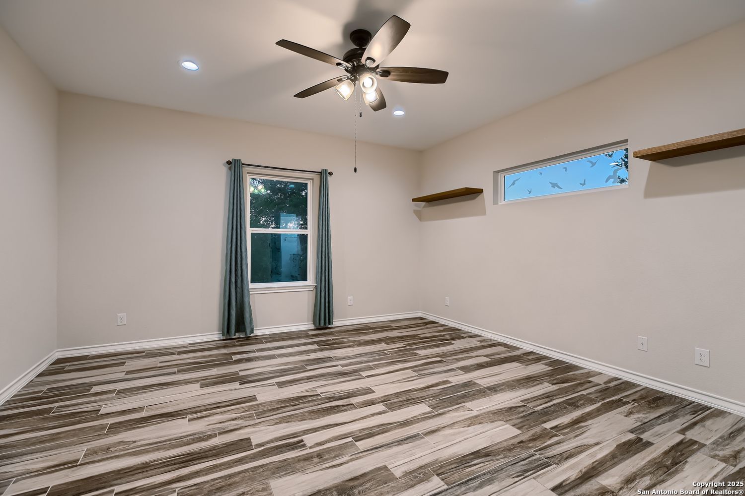 3963 Summit Hurst New Braunfels, TX 78132 - Photo 14 of 28 a view of a livingroom with a ceiling fan and window