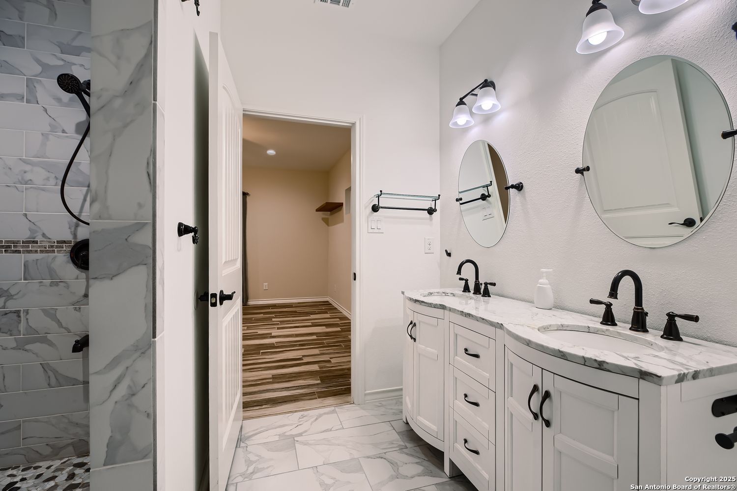 3963 Summit Hurst New Braunfels, TX 78132 - Photo 17 of 28 a bathroom with a double vanity sink mirror and shower