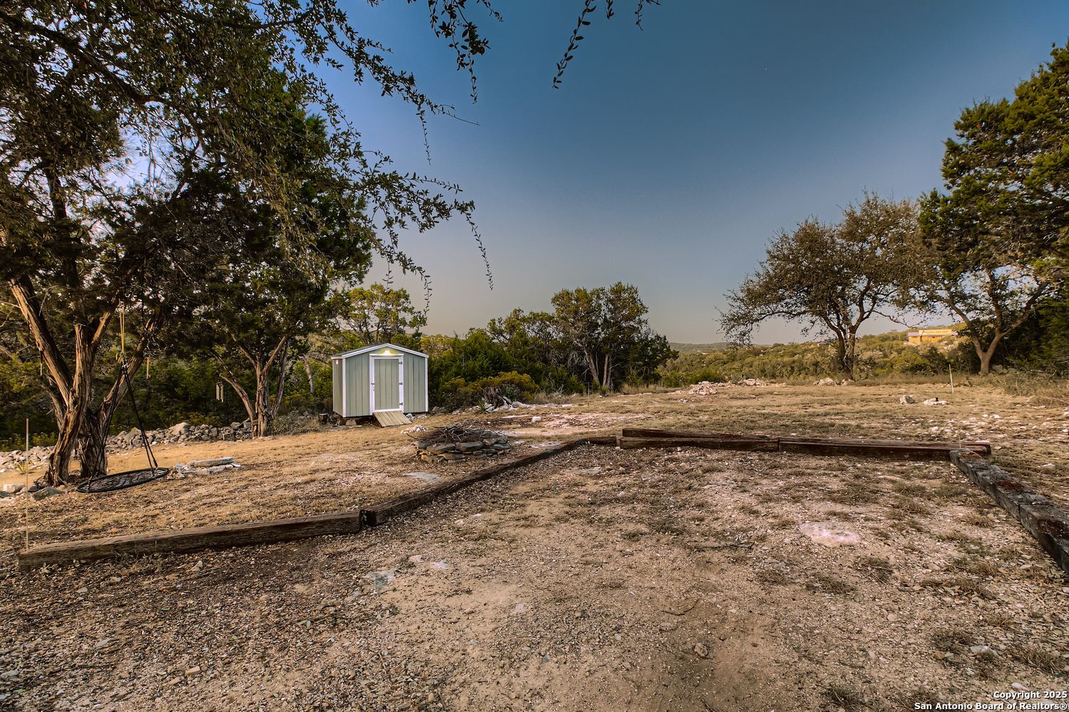 3963 Summit Hurst New Braunfels, TX 78132 - Photo 27 of 28 a view of a yard with a tree