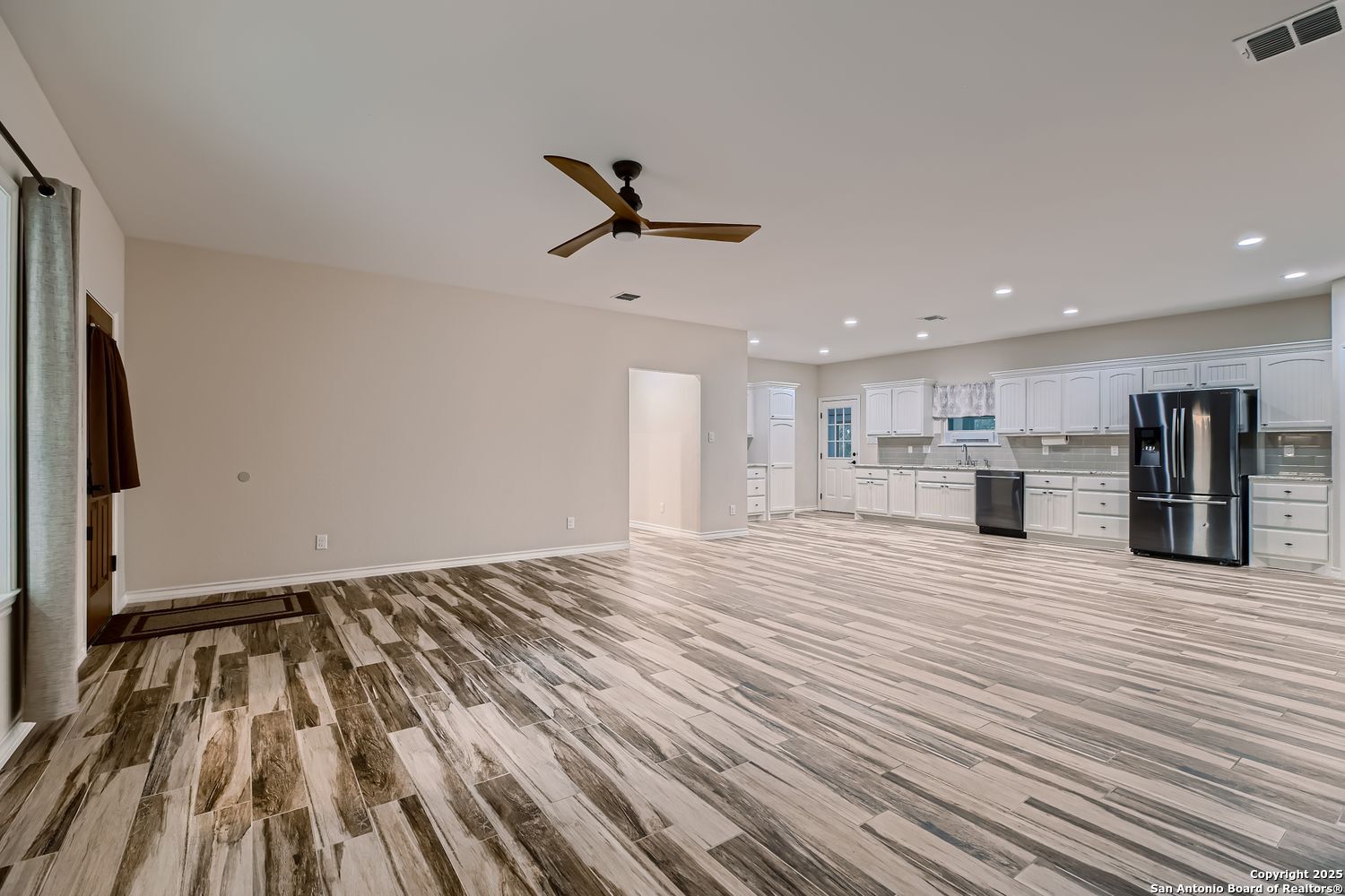 3963 Summit Hurst New Braunfels, TX 78132 - Photo 6 of 28 a view of empty room with wooden floor and window