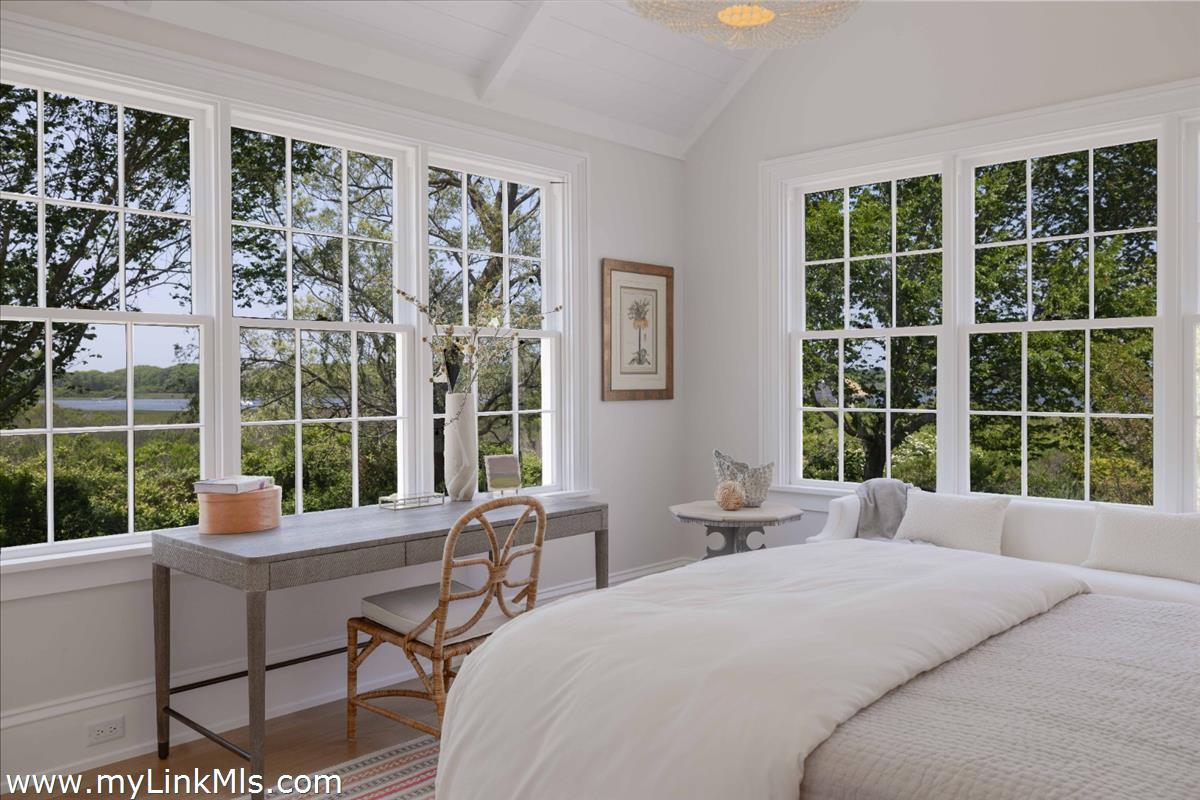 256 Polpis Road Nantucket, MA 02554 - Photo 14 of 30 a bedroom with furniture and a large window